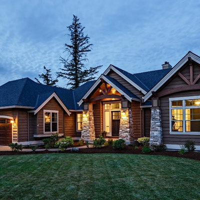 Mid-sized craftsman brown one-story mixed siding gable roof idea in Portland