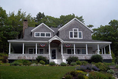 Example of a large beach style gray two-story wood exterior home design in Portland Maine with a shingle roof