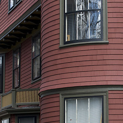 Ornate red exterior home photo in Boston