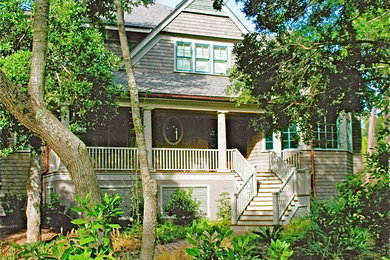 Example of a large arts and crafts brown two-story exterior home design in Charleston