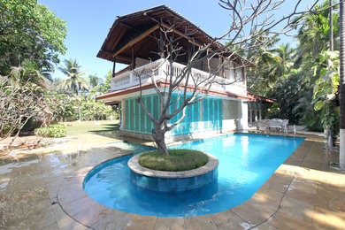 side view of the home with the pool