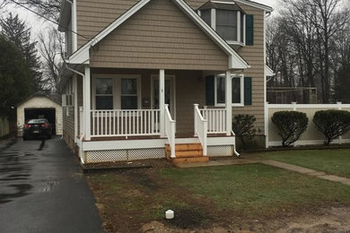 Photo of a medium sized and beige classic two floor detached house in New York with wood cladding, a pitched roof and a shingle roof.