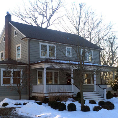 Mid-sized traditional gray two-story vinyl house exterior idea in New York with a hip roof and a shingle roof