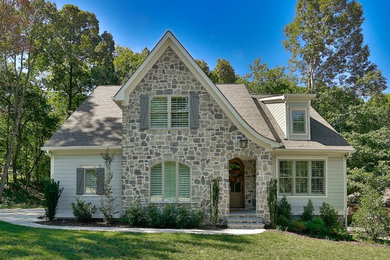 French country gray two-story vinyl house exterior idea in Other with a hip roof and a shingle roof
