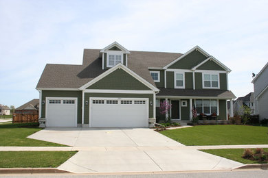 Design ideas for a green classic two floor house exterior in Chicago.