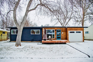 Example of a 1950s exterior home design in Denver