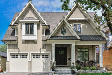 Inspiration for a craftsman beige two-story wood gable roof remodel in Toronto