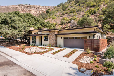 Example of a mid-sized minimalist beige one-story stucco exterior home design in San Luis Obispo