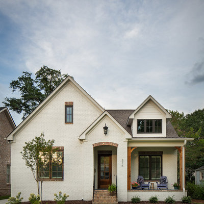 Small elegant white one-story brick exterior home photo in Birmingham with a shingle roof