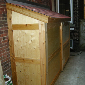 Small storage shed with sliding door