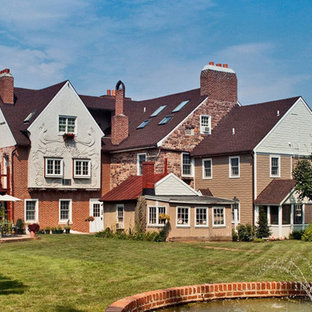 Inspiration for a mid-sized 1960s three-story exterior home remodel in Other