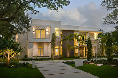 Contemporary white two-story mixed siding flat roof idea in Miami