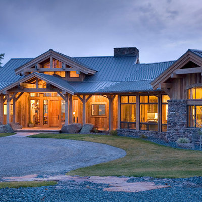 Mid-sized rustic brown one-story wood exterior home idea in Other
