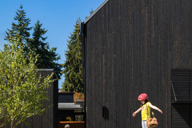 Example of a farmhouse exterior home design in Seattle