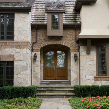 Solid White Oak Arched Top Double Front Door with Blue Stone Walkway