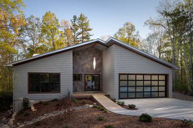 Inspiration for a mid-sized contemporary gray one-story house exterior remodel in Raleigh