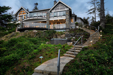 This is an example of a large and gey contemporary two floor house exterior in Vancouver with mixed cladding.