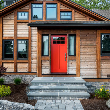 Sousugiban (burned) cedar batten siding, with a bold statement front door, and l