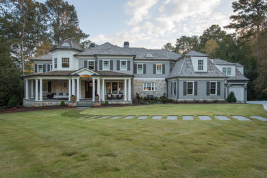 Inspiration for a timeless gray two-story exterior home remodel in Atlanta with a hip roof and a shingle roof
