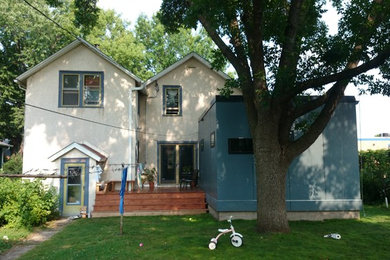 Example of a small trendy blue one-story concrete fiberboard flat roof design in Minneapolis