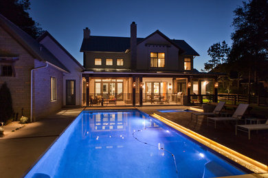 Inspiration for a transitional yellow two-story stone exterior home remodel in Houston