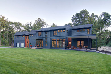 Example of a minimalist gray two-story wood exterior home design in Boston with a shingle roof