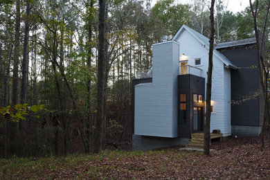 Mid-sized trendy white two-story metal gable roof photo in Atlanta