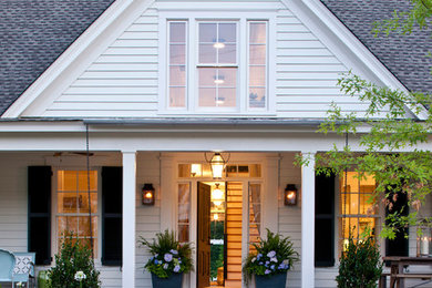 Inspiration for a mid-sized cottage white two-story vinyl gable roof remodel in Atlanta