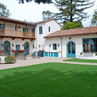 Large tuscan two-story gable roof photo in Santa Barbara
