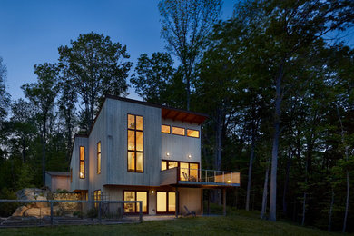 This is an example of a contemporary house exterior in Philadelphia with wood cladding.