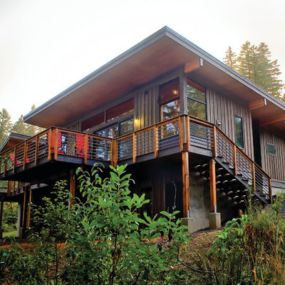 Example of a minimalist wood exterior home design in Seattle
