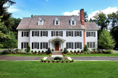 Elegant white two-story wood exterior home photo in New York