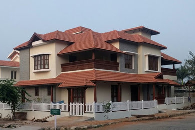 Design ideas for a world-inspired house exterior in Bengaluru.