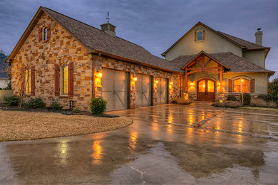 Large rustic green two-story stone gable roof idea in Houston