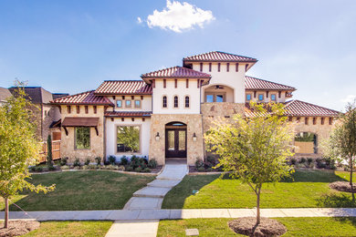 Huge mediterranean white two-story mixed siding house exterior idea in Dallas with a hip roof and a tile roof