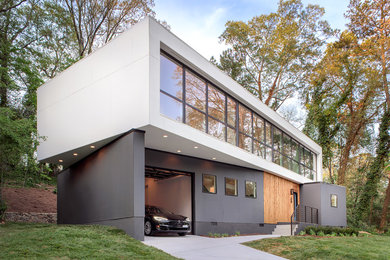 Идея дизайна: двухэтажный, большой, разноцветный частный загородный дом в современном стиле с комбинированной облицовкой и плоской крышей