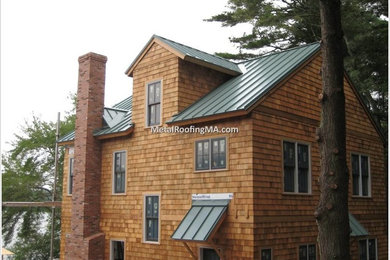 Design ideas for a large coastal two floor house exterior in Boston with wood cladding.