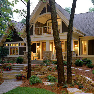 Inspiration for a huge timeless brown two-story stone exterior home remodel in Minneapolis