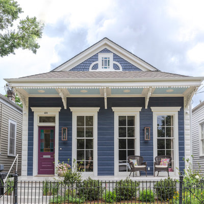 Small transitional blue one-story wood house exterior photo in New Orleans with a gambrel roof and a shingle roof