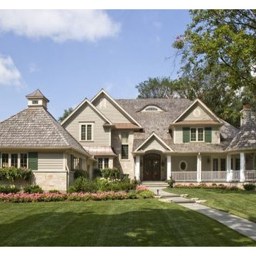 Stately Stone and Cedar Sided House with Copper Roof and Eyebrow Windows