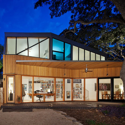 Example of a trendy two-story wood exterior home design in Austin