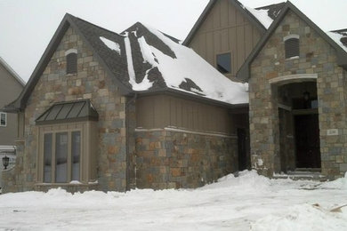 Example of a large mountain style brown two-story mixed siding exterior home design in Other with a shingle roof