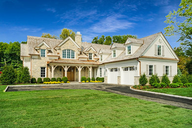 Large elegant white two-story mixed siding exterior home photo in New York with a shingle roof