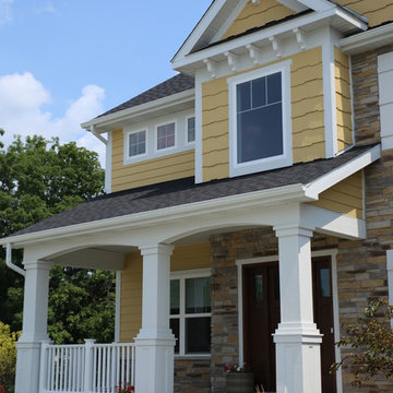 Stone and LP shake Custom home with covered front porch