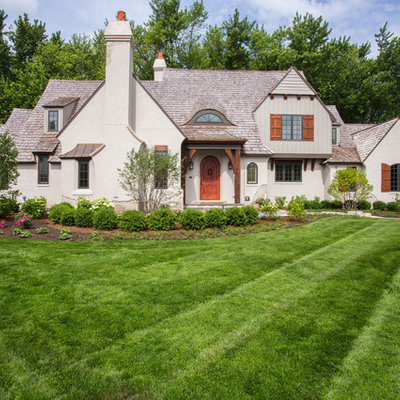 Huge elegant beige two-story stucco gable roof photo in Chicago