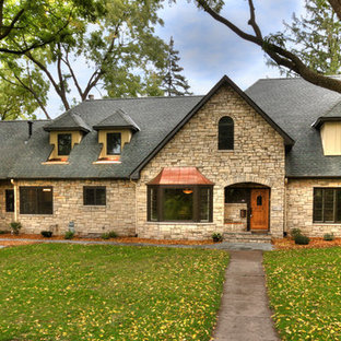 Example of a classic stone exterior home design in Minneapolis