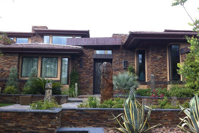 Example of a trendy stone exterior home design in Las Vegas