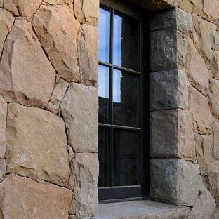 Mid-sized cottage beige one-story stone exterior home photo in Santa Barbara with a tile roof