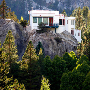 Contemporary white split-level stucco flat roof idea in Albuquerque