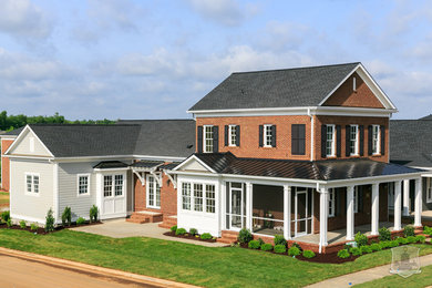 Large elegant white two-story mixed siding exterior home photo in Louisville with a shingle roof